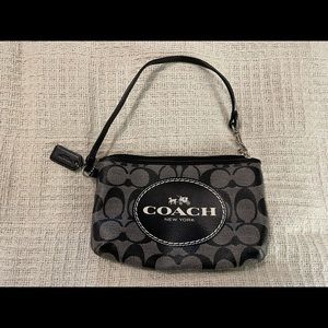Coach. Black coach wristlet .
